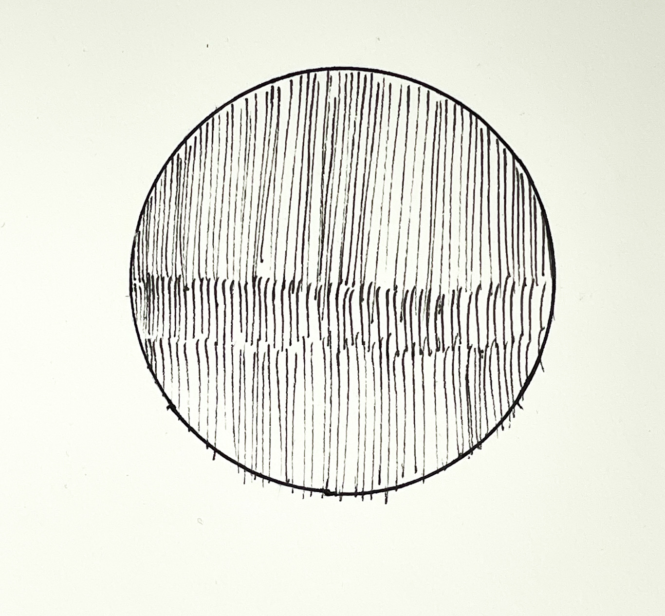 Stenciled circle filled in freehand with lines