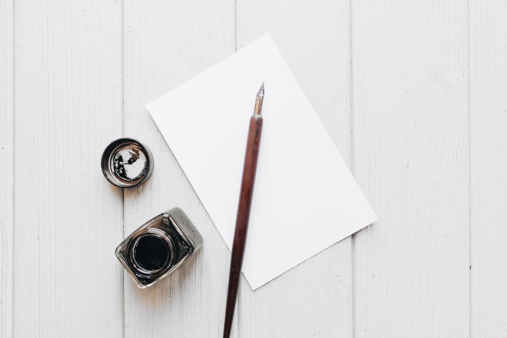 Inkpot and a blank paper
