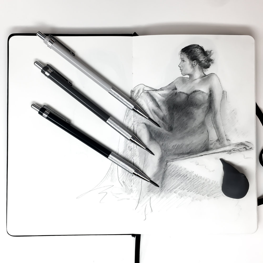 sketch of girl reclining and 3 gray scale mechanical pencils